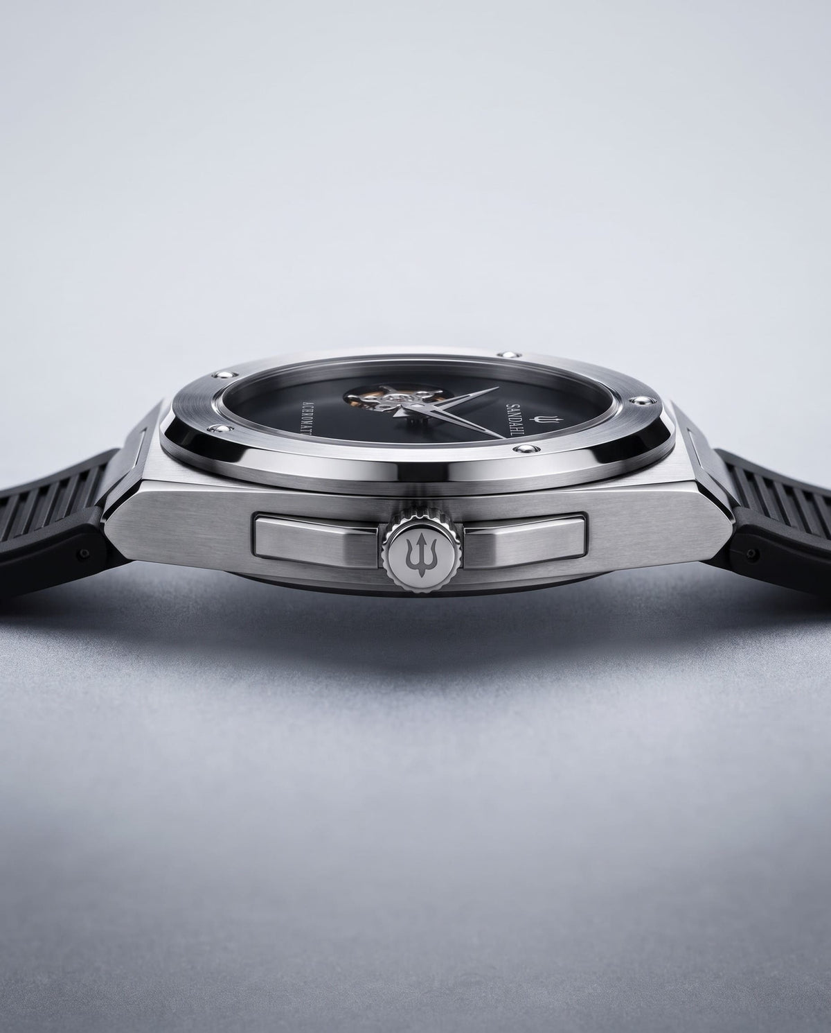 Angled view of the SANDAHL ACHROMATIC Musou with a black dial, steel case and black rubber strap.