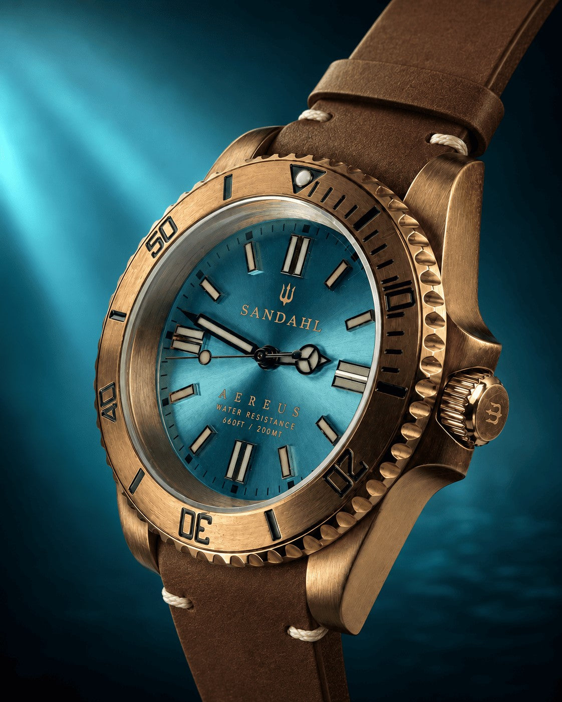 SANDAHL AEREUS Glacial Aqua with an aqua blue dial, bronze case and brown leather strap with cream stitching, viewed at an angle.