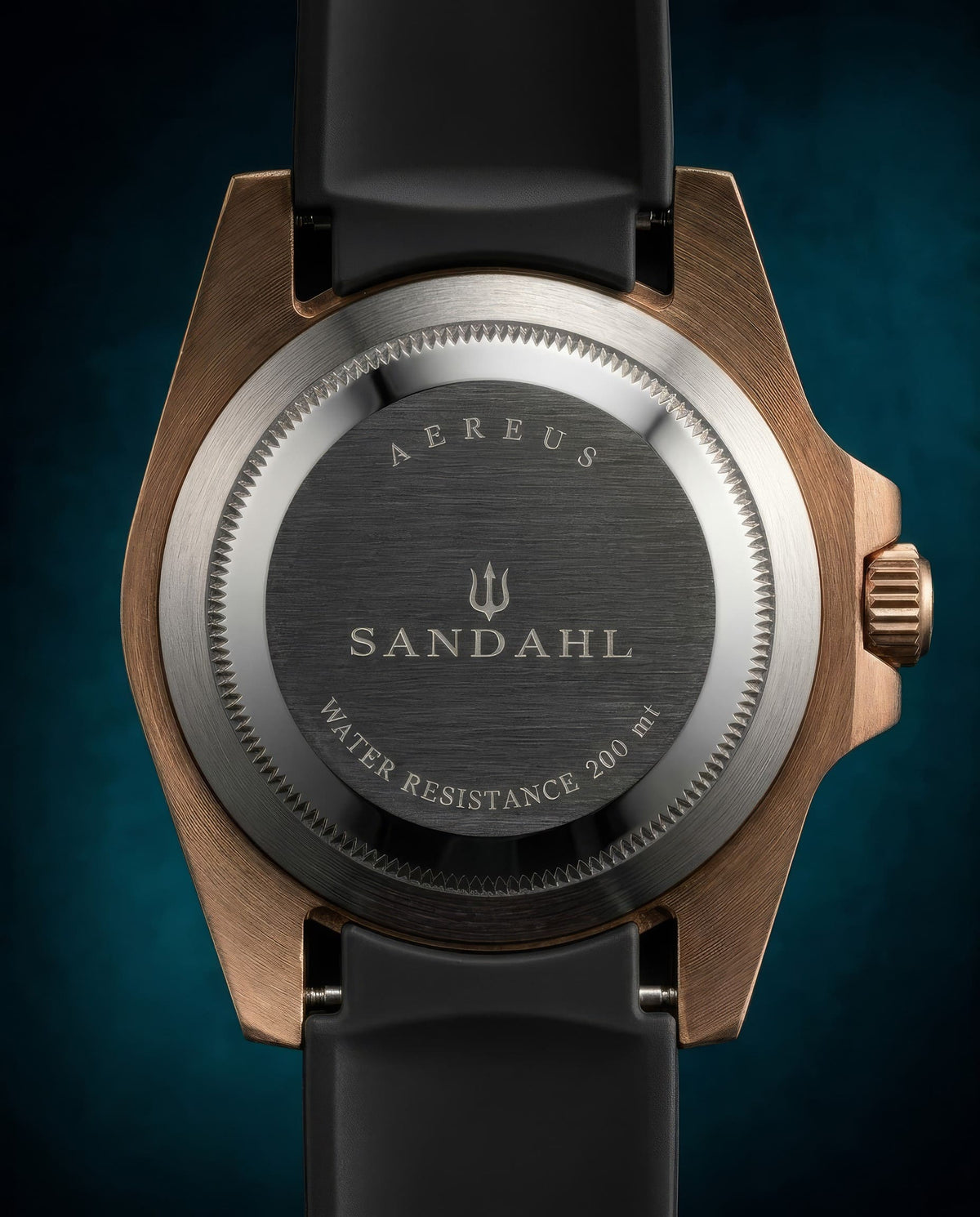 Rear view of SANDAHL AEREUS Patina Teal, showing its engraved steel caseback, bronze case and black rubber strap.