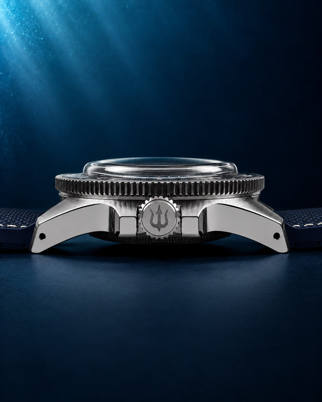 Side profile of SANDAHL CENTURION Abyss Blue, showing the domed crystal, steel case and trident-engraved crown.