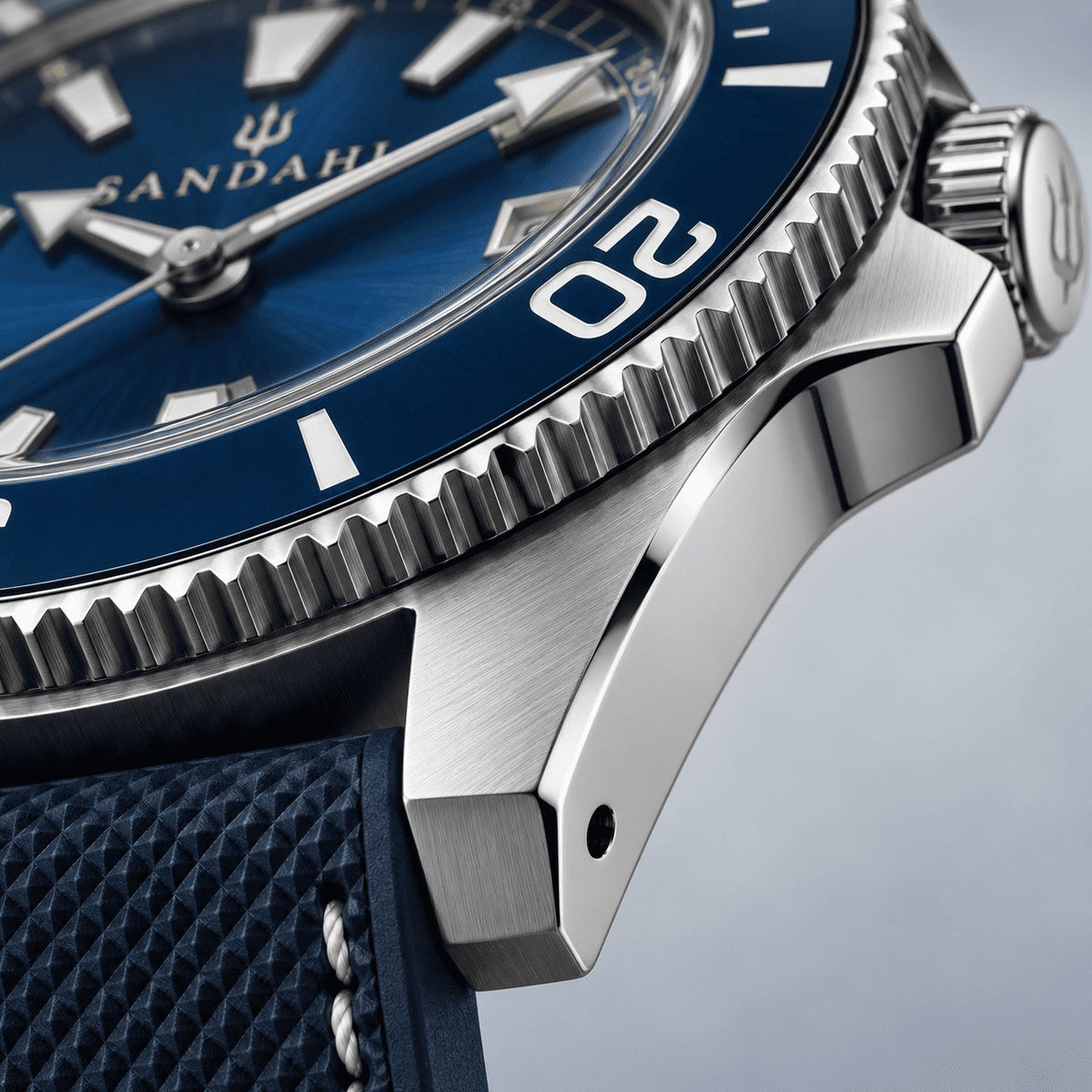 Close-up of the SANDAHL CENTURION Abyss Blue brushed steel case, blue bezel and domed crystal.