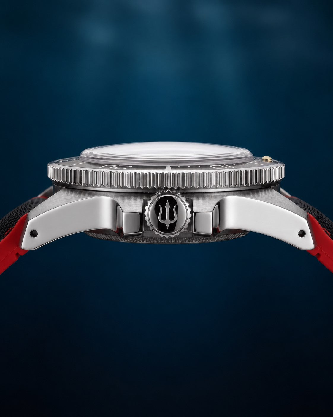 Side profile of SANDAHL CENTURION Signal Red, showing the domed crystal, steel case and trident-engraved crown.