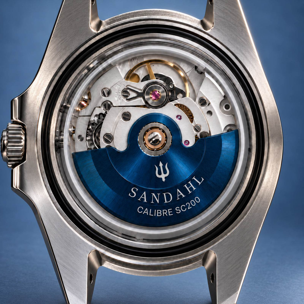 Close-up of the SANDAHL SHALLOW movement in its stainless steel case, with a blue rotor engraved SANDAHL and CALIBRE SC200.