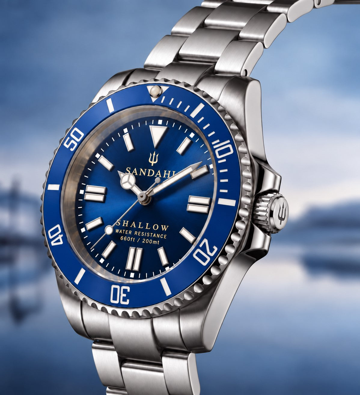 SANDAHL SHALLOW Kattegatt Blue in an angled product view with blue sunburst dial, blue dive bezel and brushed stainless-steel bracelet.