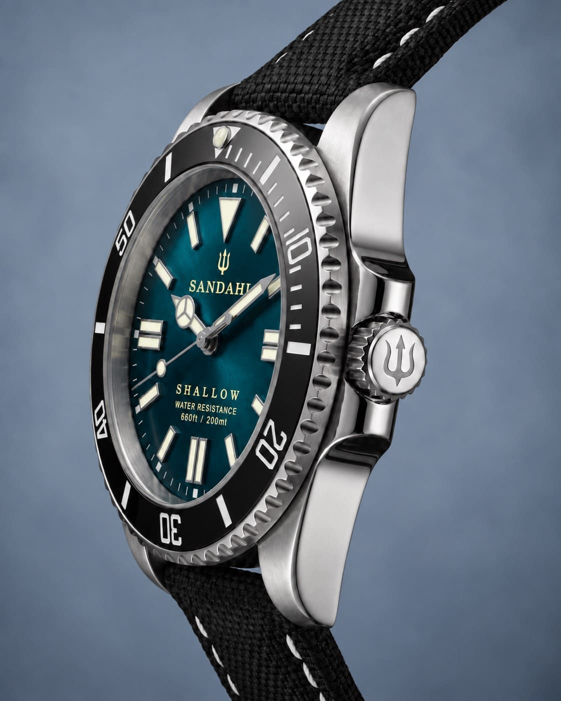 SANDAHL SHALLOW Skagerrak Teal dive watch with black sailcloth strap shown from an angled side view.