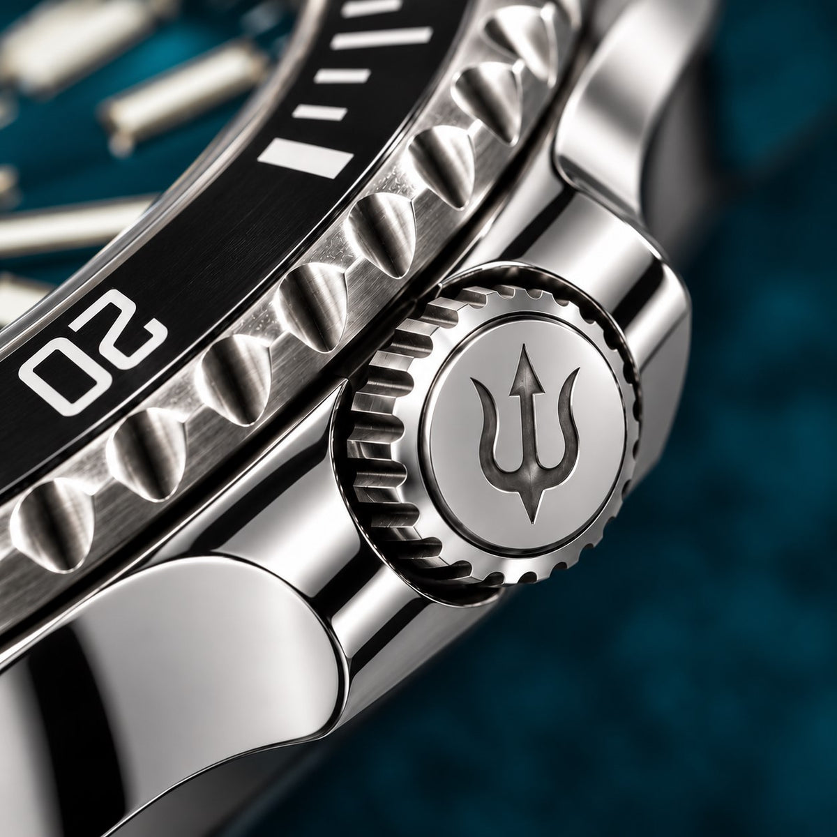 Trident-engraved crown and polished crown guards on SANDAHL SHALLOW Skagerrak Teal, beside the black dive bezel.