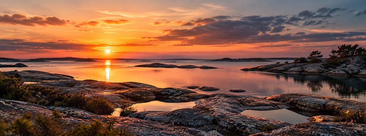 SANDAHL SHALLOW collection – sunset over a calm Scandinavian archipelago with low coastal rocks