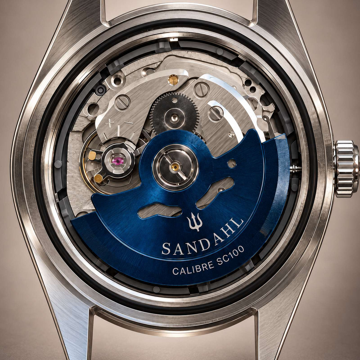 Close-up of the SANDAHL SUITS movement in its stainless steel case, with a blue rotor engraved SANDAHL and CALIBRE SC100.