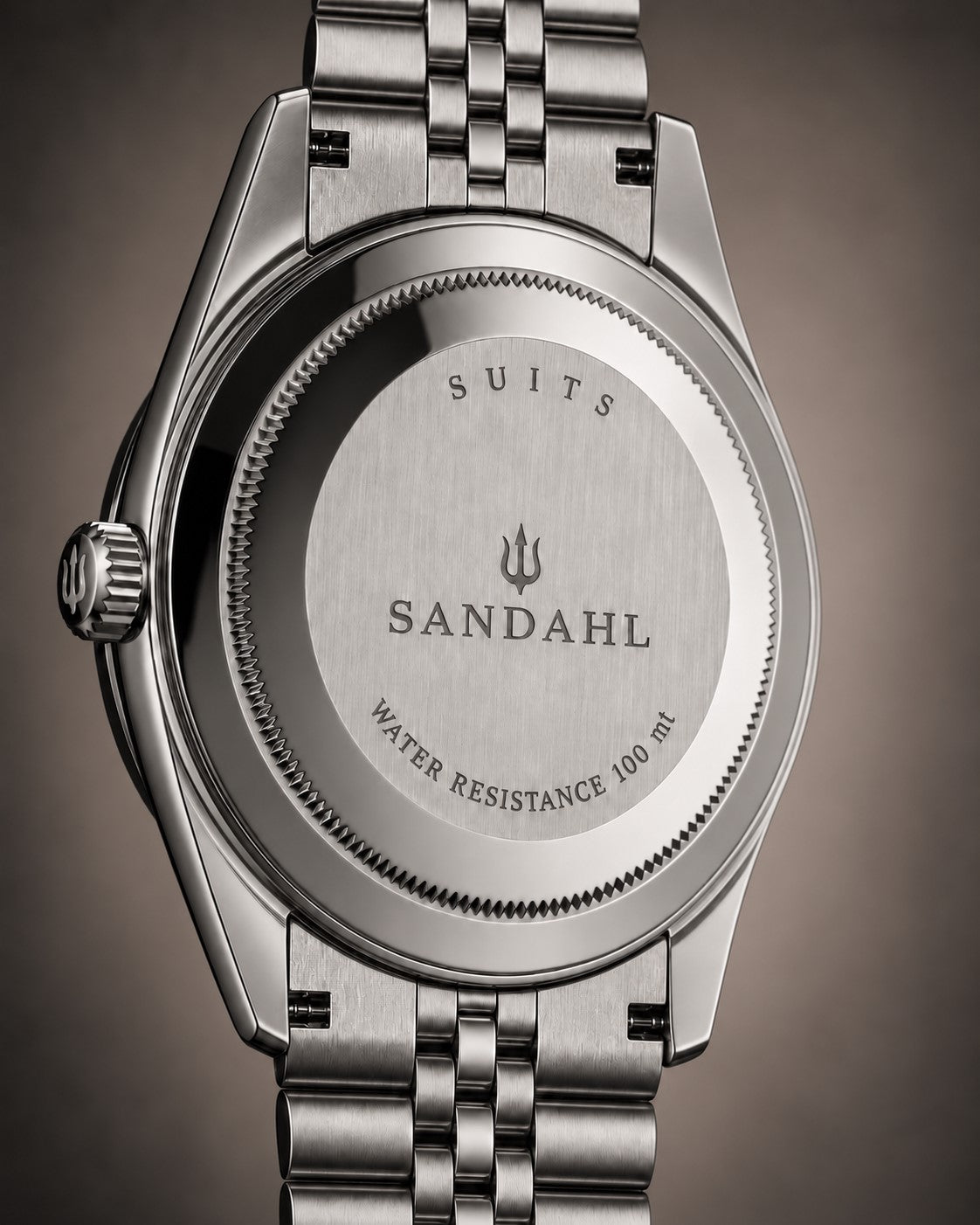 Rear view of a SANDAHL SUITS watch with an engraved stainless steel caseback and Jubilee-style bracelet.