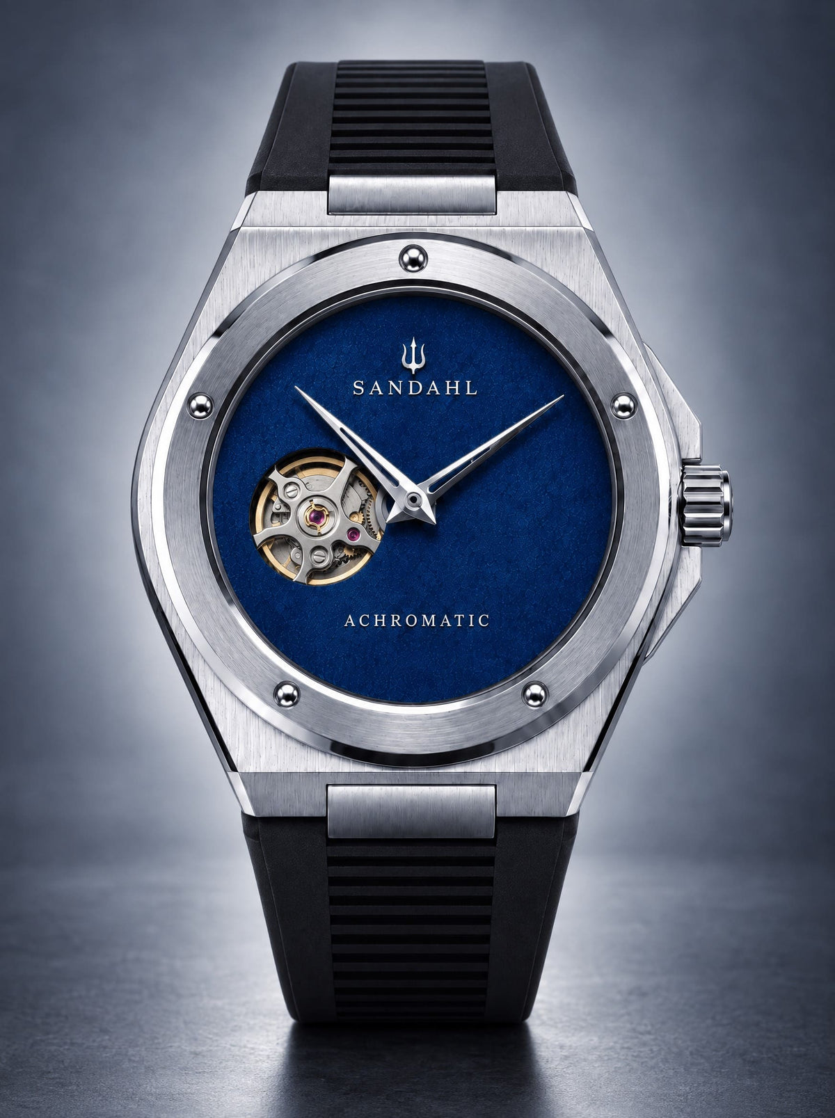 SANDAHL ACHROMATIC Cobalt with a blue open-heart dial and black rubber strap, viewed from the front.