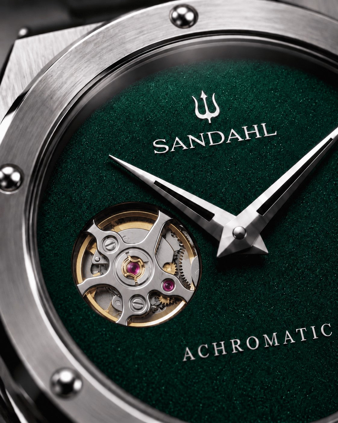 Close-up of the green SANDAHL ACHROMATIC Petrol dial, showing the open-heart aperture and polished hands.