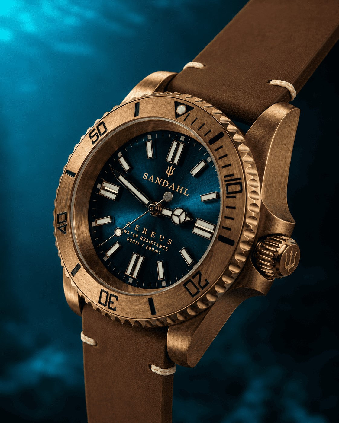 SANDAHL AEREUS Patina Teal with a blue-green dial, bronze case and brown leather strap with cream stitching, viewed at an angle.
