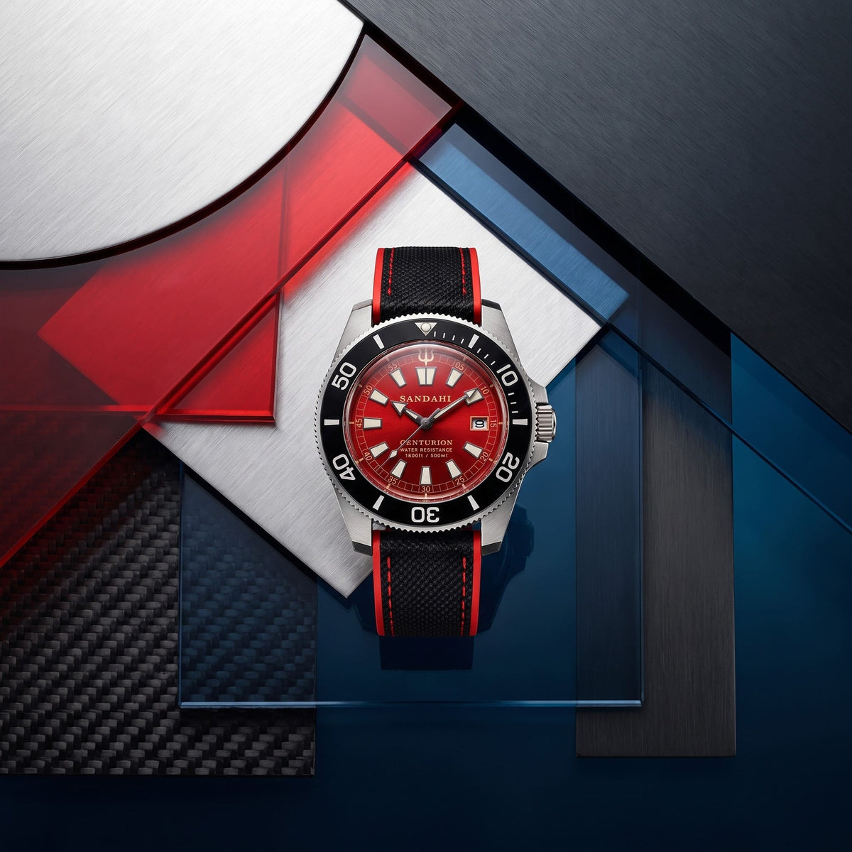 SANDAHL CENTURION red dial watch with a black and red strap, arranged on brushed metal and red and blue glass panels.