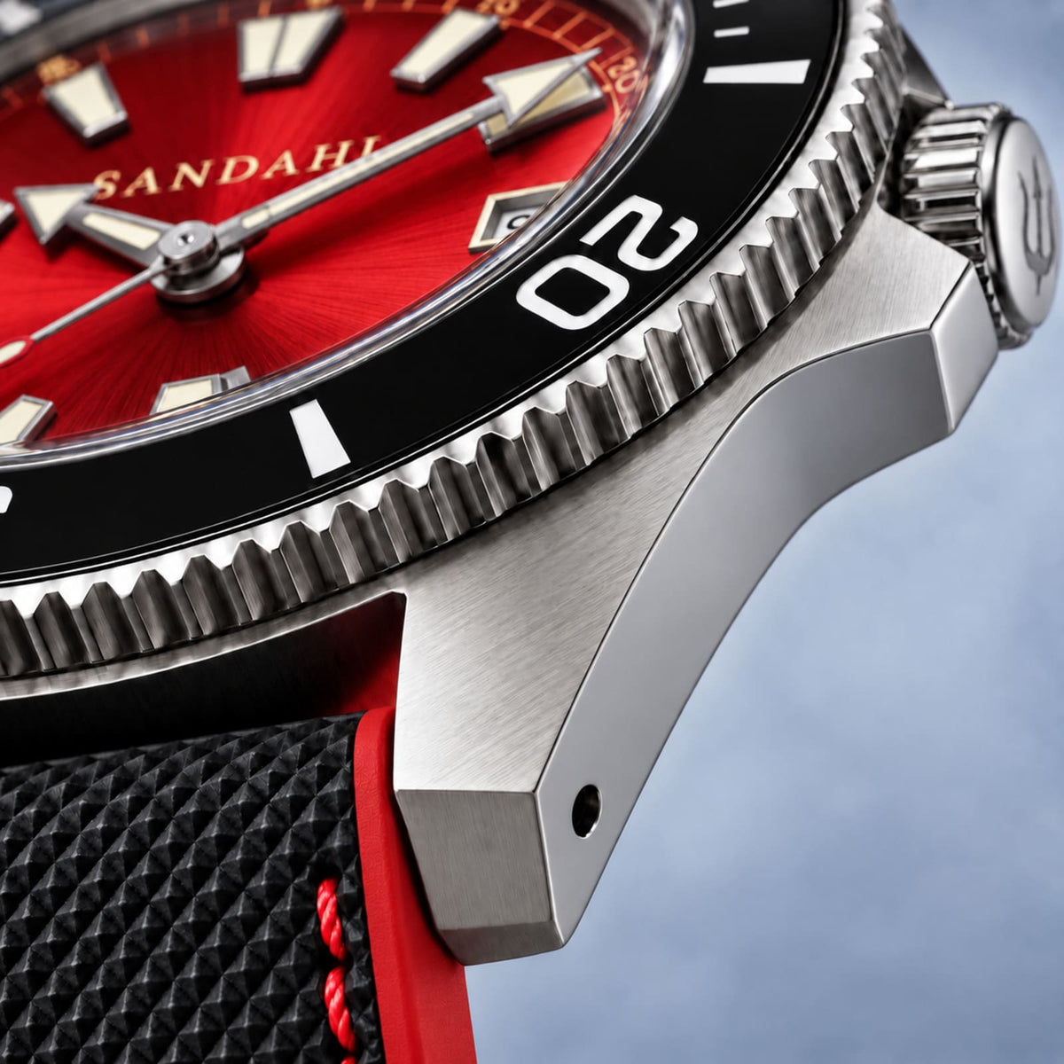 Macro view of the SANDAHL CENTURION Signal Red steel case, black bezel and black strap with red accents.