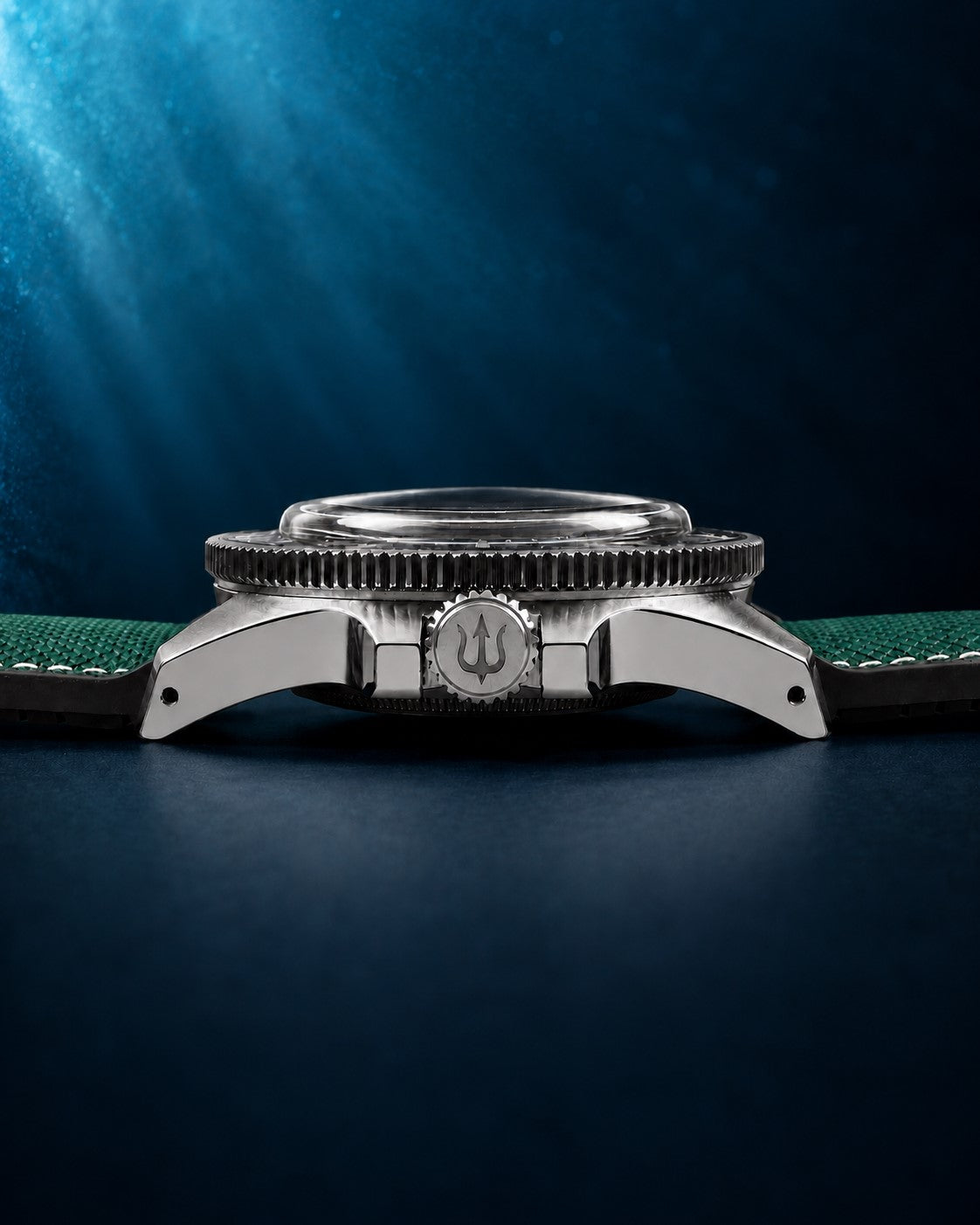 Side profile of SANDAHL CENTURION Trench Green, showing the domed crystal, steel case and trident-engraved crown.