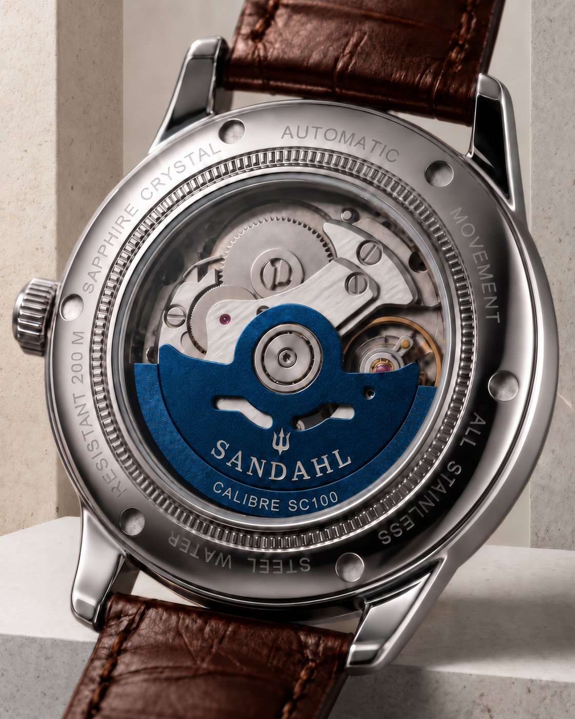 SANDAHL ORNATUS Cobalt exhibition caseback showing the automatic movement and blue rotor engraved CALIBRE SC100.