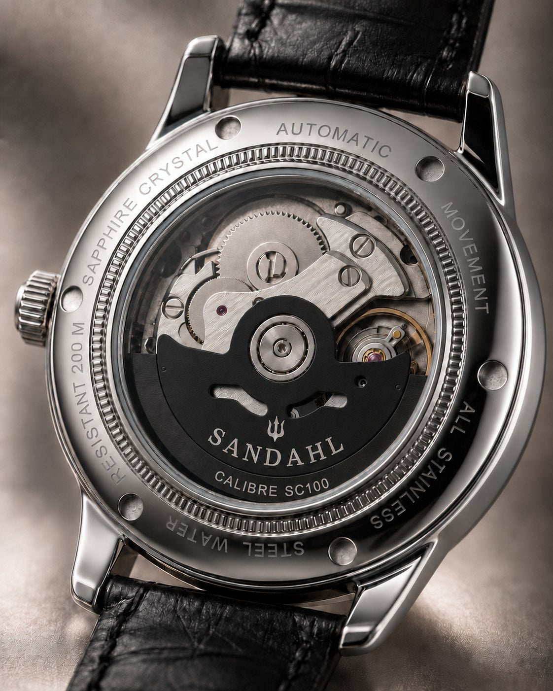 SANDAHL ORNATUS Onyx exhibition caseback showing the automatic movement and black rotor engraved CALIBRE SC100.