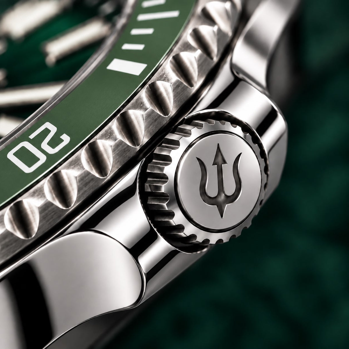Trident-engraved crown and polished crown guards on SANDAHL SHALLOW Archipelago Green, beside the green dive bezel.