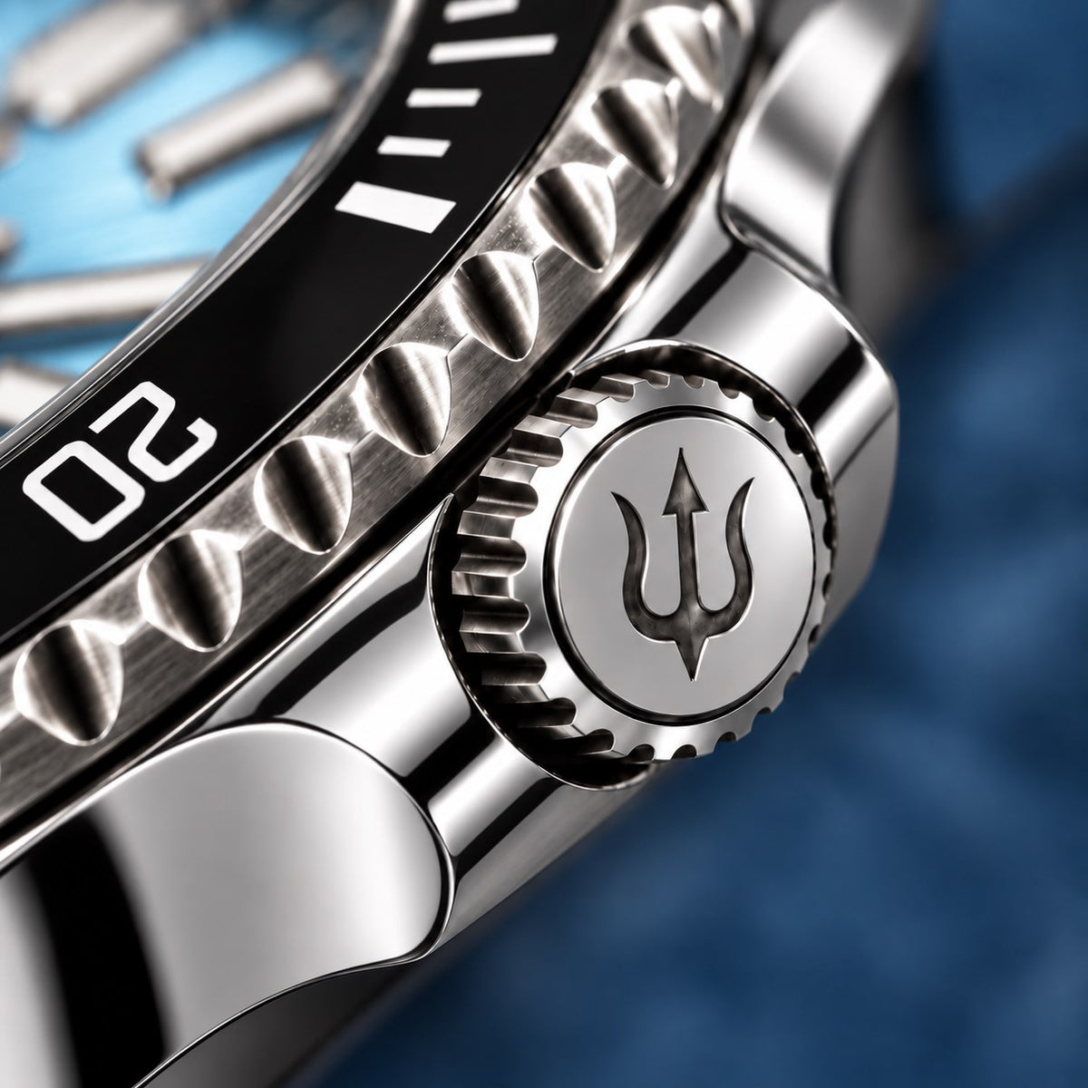 Trident-engraved crown and polished crown guards on SANDAHL SHALLOW Glacial Blue, beside the black dive bezel.