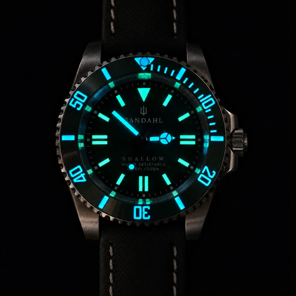 SANDAHL SHALLOW watch with luminous hands, hour markers and bezel markings against a dark background.