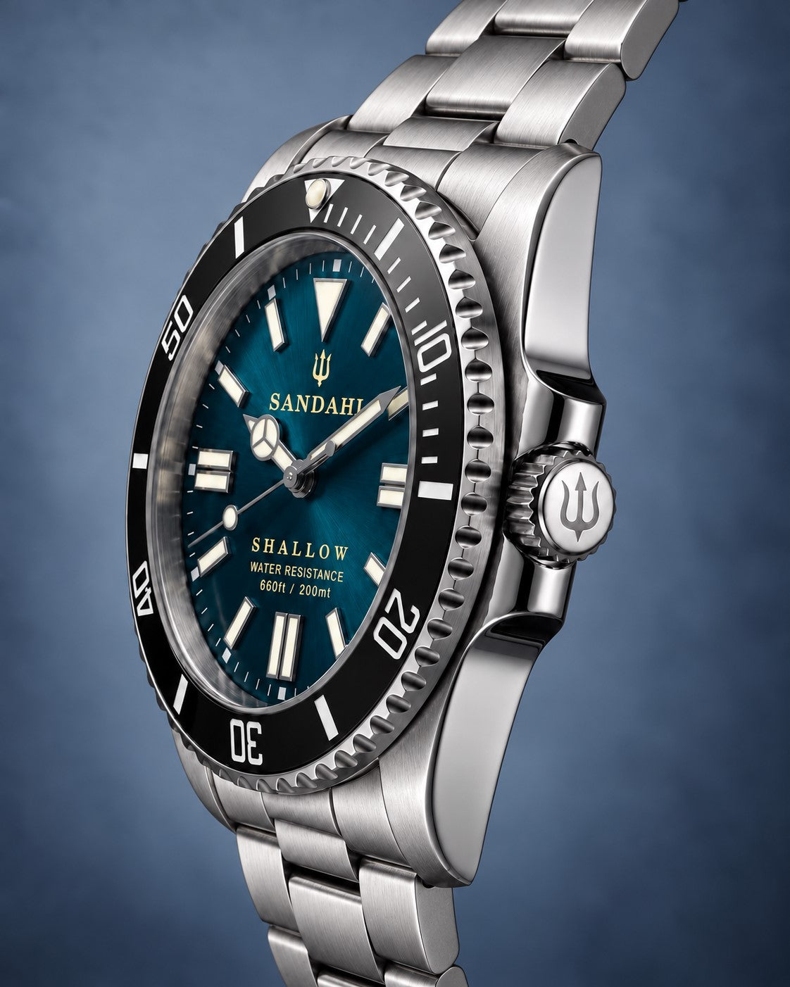 SANDAHL SHALLOW Skagerrak Teal dive watch with stainless steel bracelet shown from an angled side view.
