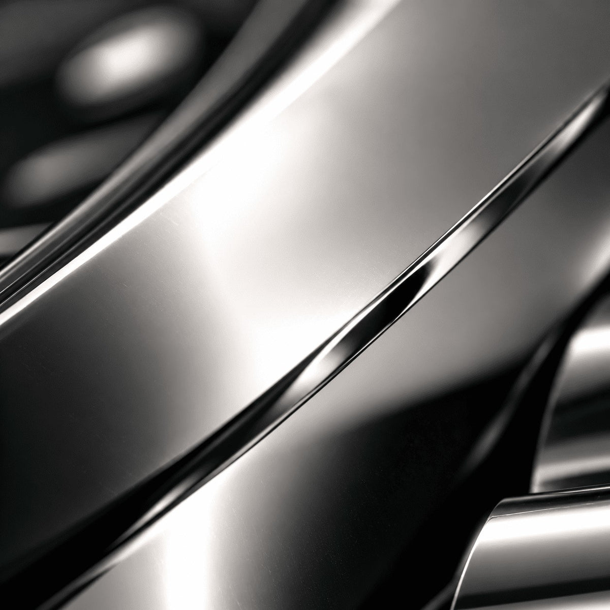 Extreme close-up of the polished steel case and rounded bezel of a SANDAHL SUITS watch.