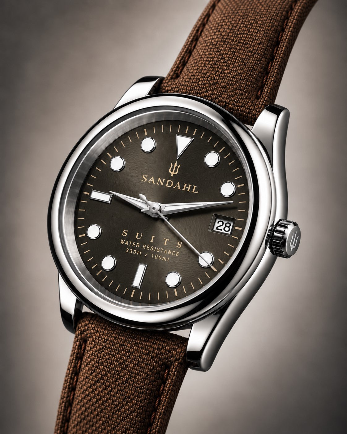 SANDAHL SUITS Savile Taupe with a taupe dial with olive reflections and brown textile strap, viewed at an angle.