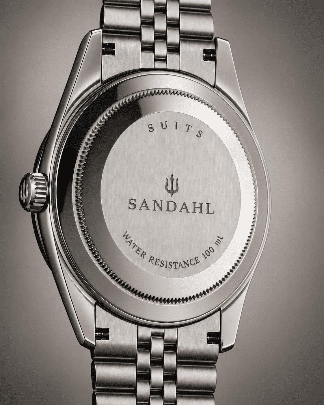 Rear view of a SANDAHL SUITS watch with an engraved stainless steel caseback and Jubilee-style bracelet.